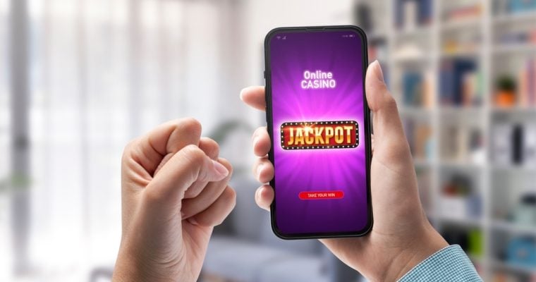 User winning jackpot on online casino app, online games and gambling concept
