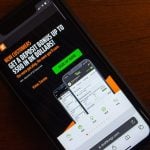 Website of DraftKings seen on iPhone screen