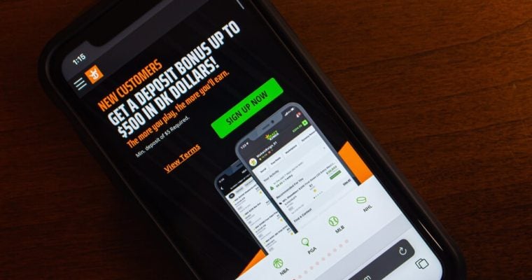 Website of DraftKings seen on iPhone screen