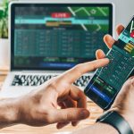 a man making bets using gambling mobile application on his phone