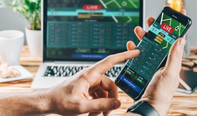 a man making bets using gambling mobile application on his phone
