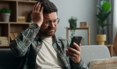 guys placing bets at a sports betting platform and losing, disappointed