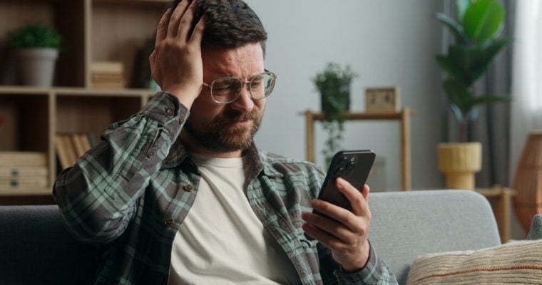 guys placing bets at a sports betting platform and losing, disappointed