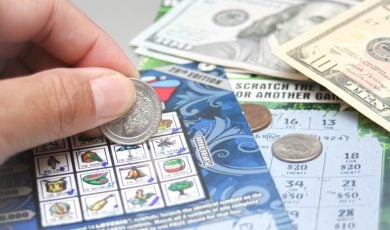 scratching lottery ticket in USA