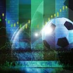 soccer ball on grass with financial stock market chart overlay, sports betting odds