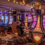 tourists gambling at slot machines inside the fancy casino in Las Vegas