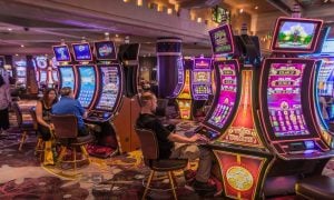 tourists gambling at slot machines inside the fancy casino in Las Vegas