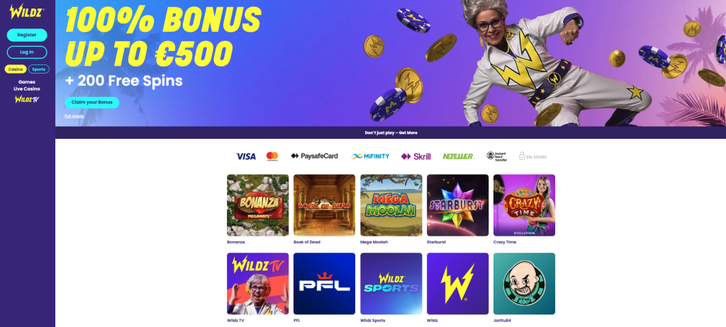 Wildz online casino homepage featuring a large promotional banner with the text “100% BONUS UP TO €500 + 200 Free Spins” and a “Claim your Bonus” button. The banner has a blue-to-purple gradient background, animated casino chips and coins, and a person in a white and yellow costume. A dark purple sidebar on the left contains the Wildz logo, Register and Log In buttons, and navigation links for Casino, Sports, Games, Live Casino, and Wildz TV. Below the banner are payment method logos including Visa, Mastercard, PaysafeCard, MiFinity, Skrill, Neteller, Instant Bank Transfer, and SSL Secure. The main content area displays game tiles for Bonanza, Book of Dead, Mega Moolah, Starburst, and Crazy Time, along with promotional tiles for Wildz TV, PFL, Wildz Sports, Wildz, and Jarttu84.