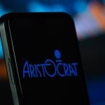 Aristocrat logo is seen on a smartphone
