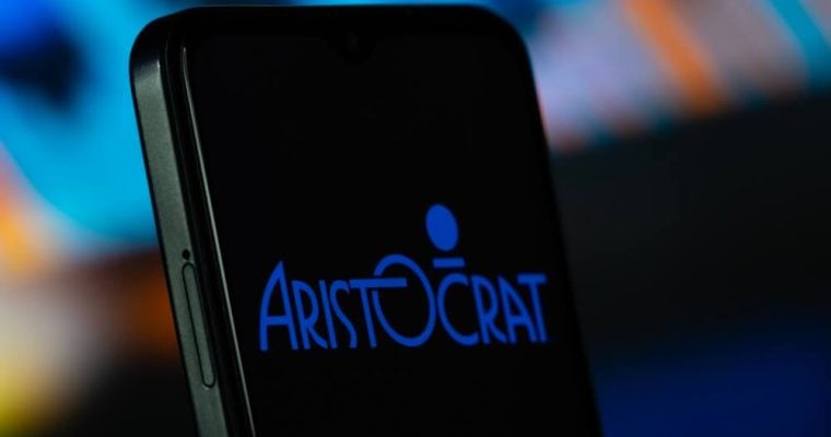 Aristocrat logo is seen on a smartphone