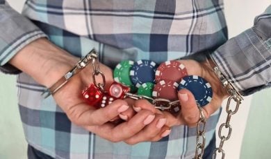 Casino chips dice and persons in handcuffs