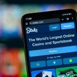 Close-up of Stake's homepage on a smartphone
