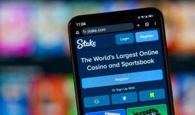 Close-up of Stake's homepage on a smartphone