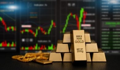 Digital gold price stock market trading charts with stacked fine gold bars