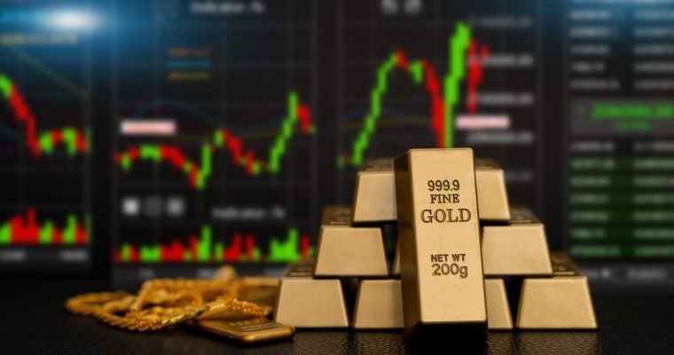 Digital gold price stock market trading charts with stacked fine gold bars