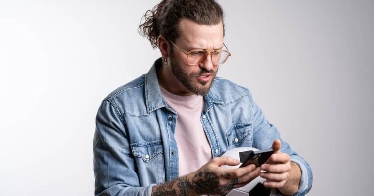 Man shocked and frustrated after losing soccer bet
