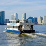 NY waterway, a commuting ferry, crossing Hudson River to head to jersey city