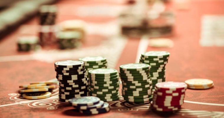 close up view of poker chips on table in casino
